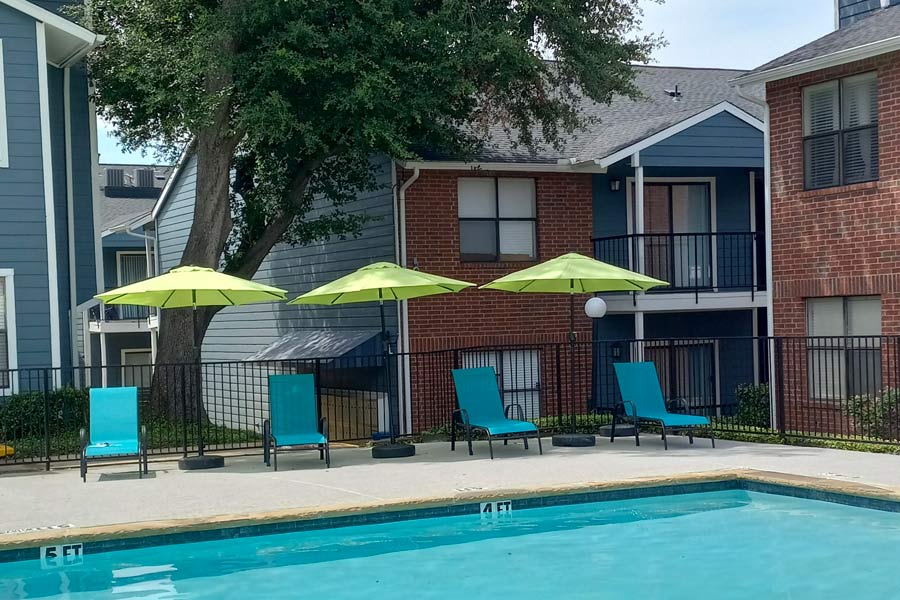 community pool with lounge seating
